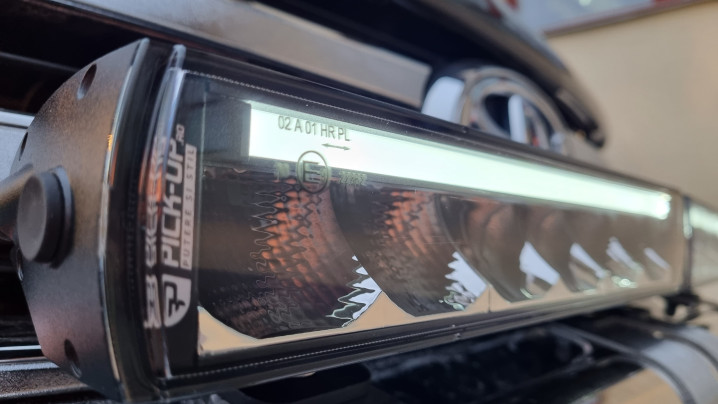 Roll cover, bed liner, bullbar, window visors, hood guard, spot lights installed on Hilux