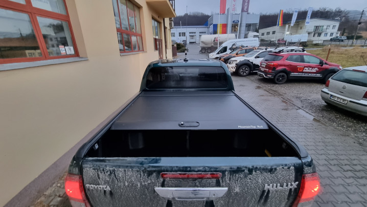 Roll cover, bed liner, bullbar, window visors, hood guard, spot lights installed on Hilux