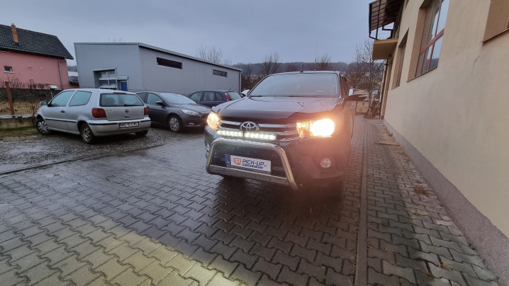 Roll cover, bed liner, bullbar, window visors, hood guard, spot lights installed on Hilux