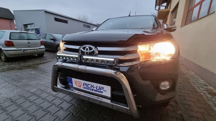 Roll cover, bed liner, bullbar, window visors, hood guard, spot lights installed on Hilux