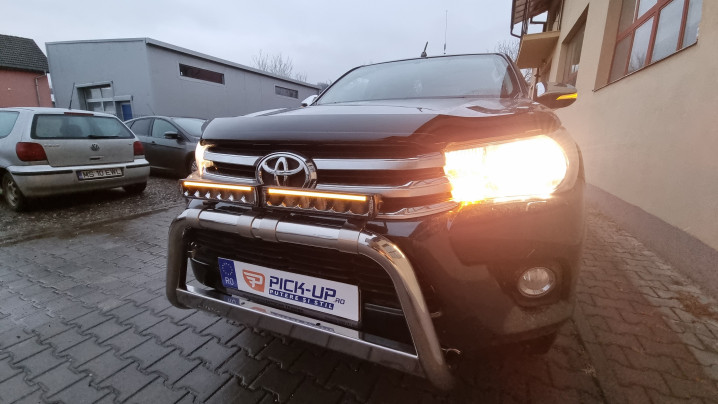 Roll cover, bed liner, bullbar, window visors, hood guard, spot lights installed on Hilux