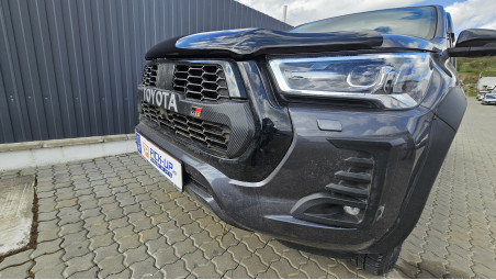 Bed liner, roll cover, rollbar, cross bars, window visors installed on Hilux GR Sport