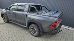Bed liner, roll cover, rollbar, cross bars, window visors installed on Hilux GR Sport