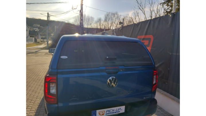 Canopy, bed liner, side steps, tailgate asistance installed on Volkswagen Amarok