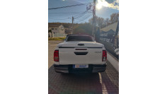 Tonneau sport cover, bed liner,overfenders, window visors installed on Toyota Hilux 2024 2