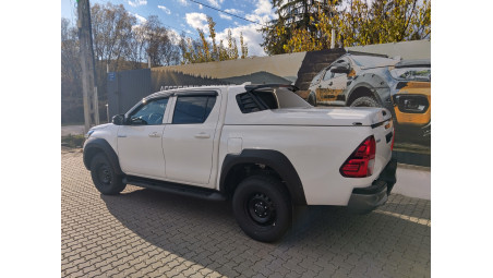 Tonneau sport cover, bed liner,overfenders, window visors installed on Toyota Hilux 2024