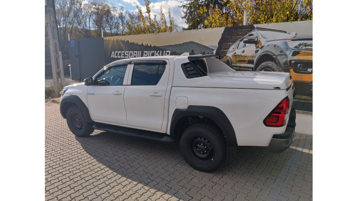 Tonneau sport cover, bed liner,overfenders, window visors installed on Toyota Hilux 2024
