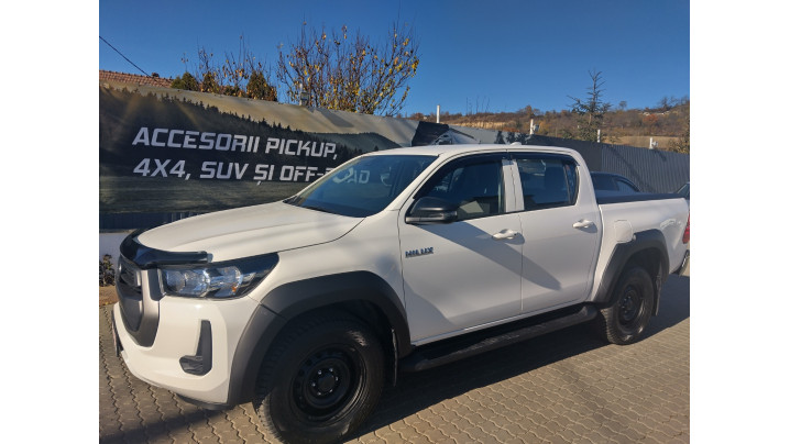 Roll cover, hood guard, window visors installed on Toyota Hilux 2024