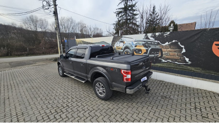 Roll cover and cross bars installed on Ford F150 2019