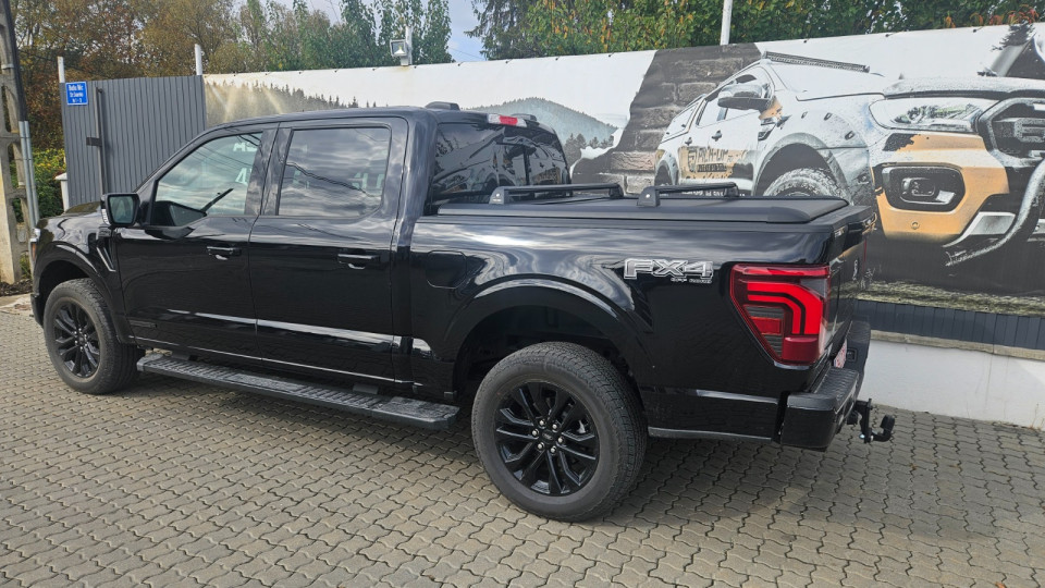 Roll cover and cross bars installed on Ford F150 Lariat