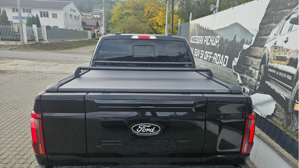 Roll cover and cross bars installed on Ford F150 Lariat