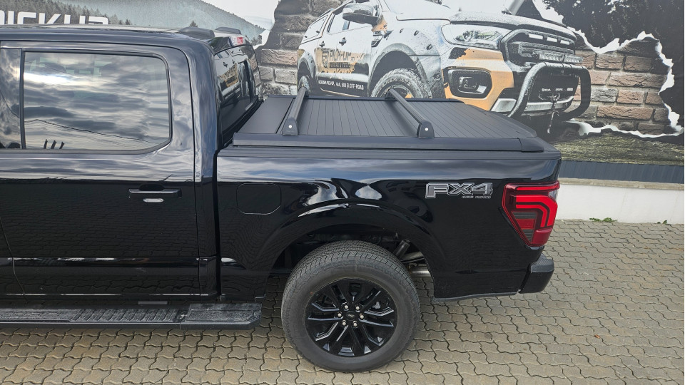 Roll cover and cross bars installed on Ford F150 Lariat