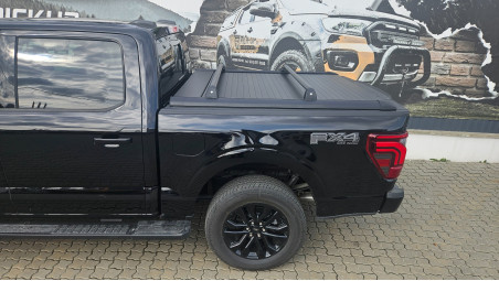 Roll cover and cross bars installed on Ford F150 Lariat